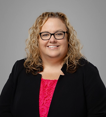 Headshot of SHAZAM Chief Legal Counsel Amy Adkins